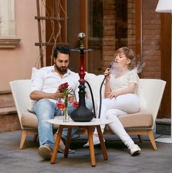 hookah hose adapter in use outside with friends